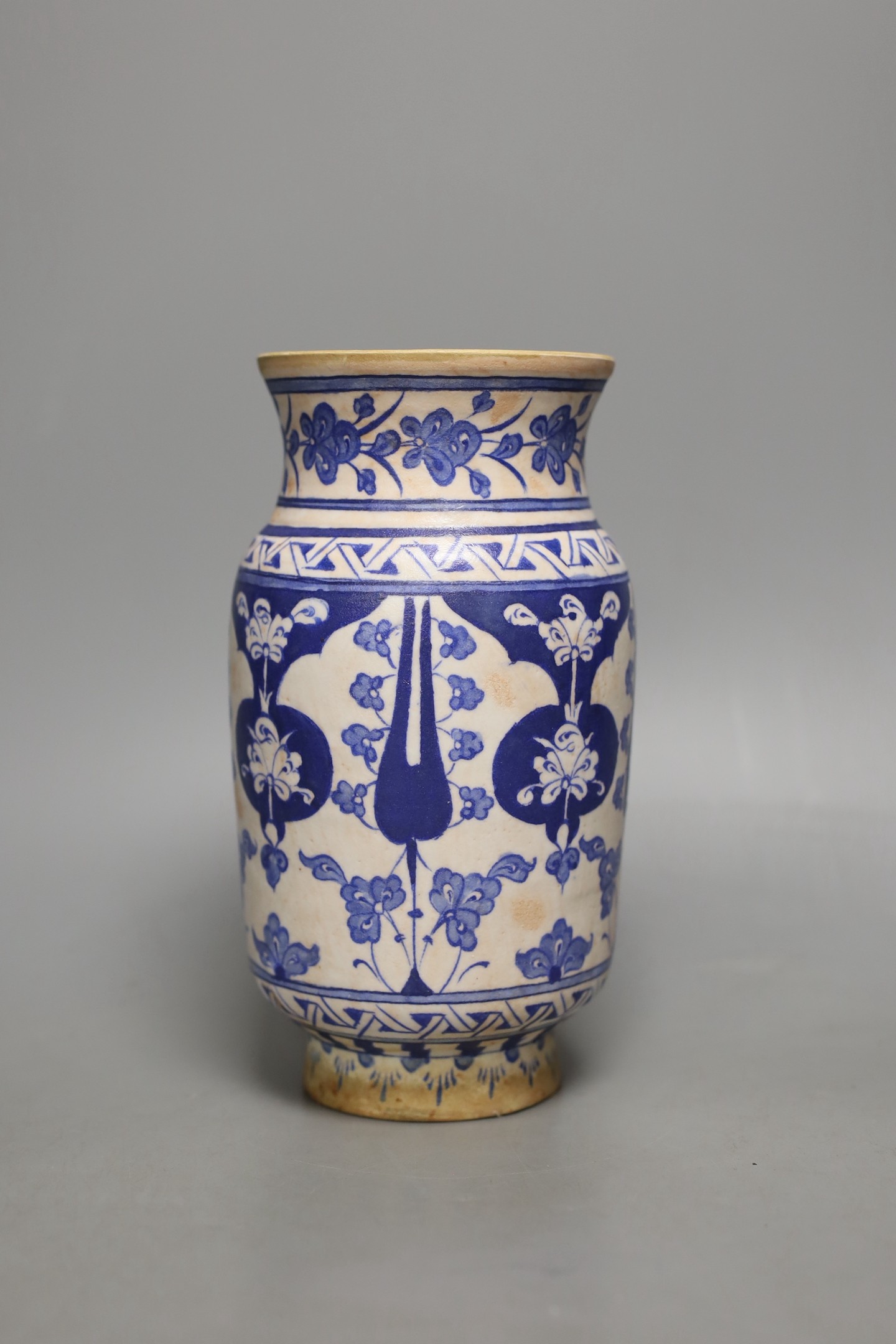 An Iznik fritware vase, 20.5 cms high.